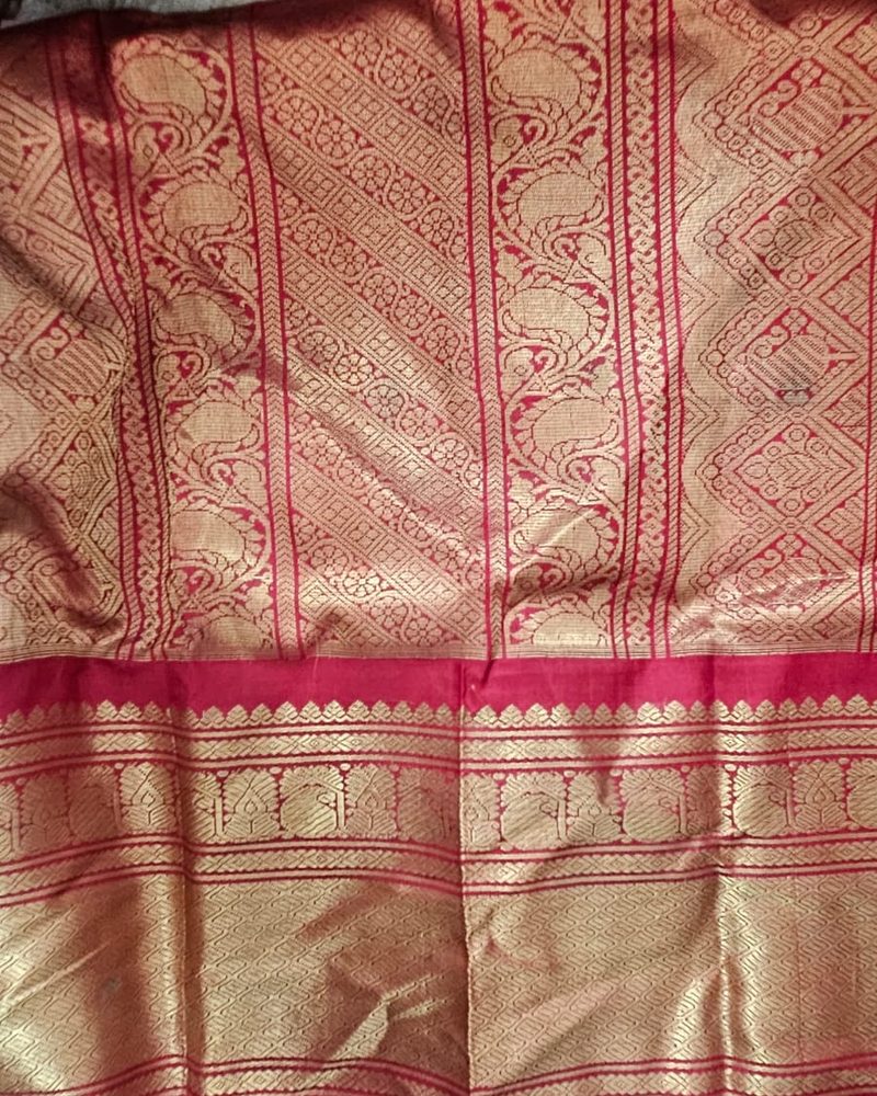 Red silk saree with gold zari peacock border